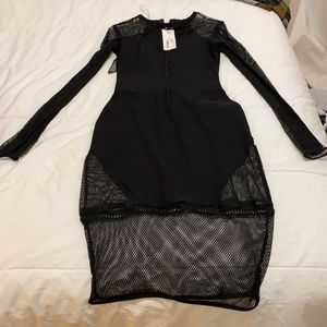 Sexy Black dress w/mess inserts. Size 6 US/10 UK.